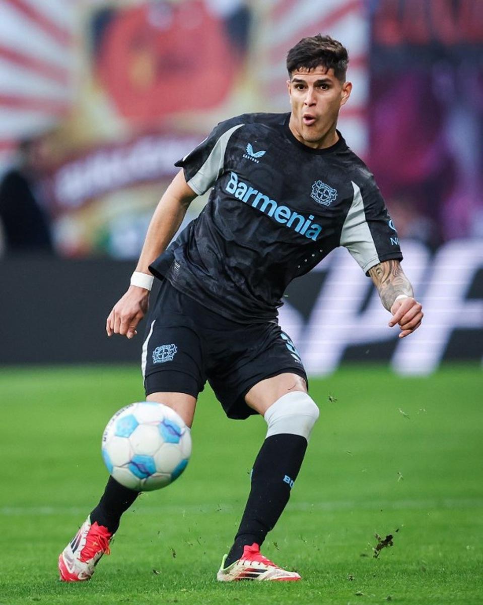 Bayer Leverkusen's Ecuadorian defender #03 Piero Hincapie plays the ball during the German first division Bundesliga football match RB Leipzig vs Bayer 04 Leverkusen in Leipzig, eastern Germany on January 25, 2025. Ronny Hartmann / AFP