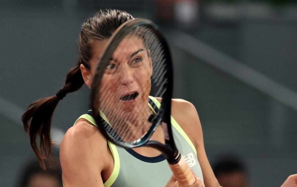 Romania's Sorana Cirstea returns the ball to Poland's Iga Swiatek during their second round of the 2024 WTA Tour Madrid Open tournament tennis match at Caja Magica in Madrid on April 27, 2024. Thomas COEX / AFP