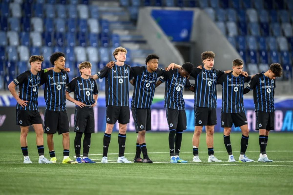 Club Brugge's players look on during the penalty shoot-out during the penalty shoot-out during the UEFA Youth League final football match between Club Brugge and Real Madrid at Stade de la Tuiliere in Lausanne, on April 20, 2026. Fabrice COFFRINI / AFP
