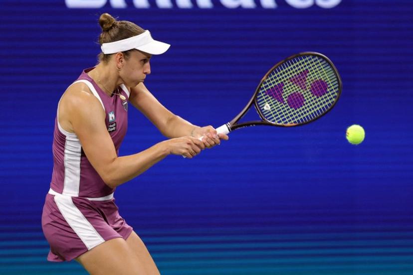 Belgium's Elise Mertens hits a return to Japan's Naomi Osaka in their women's singles third round tennis match on day seven of the US Open tennis tournament at the USTA Billie Jean King National Tennis Center in New York City on September 5, 2026. KENA BETANCUR / AFP