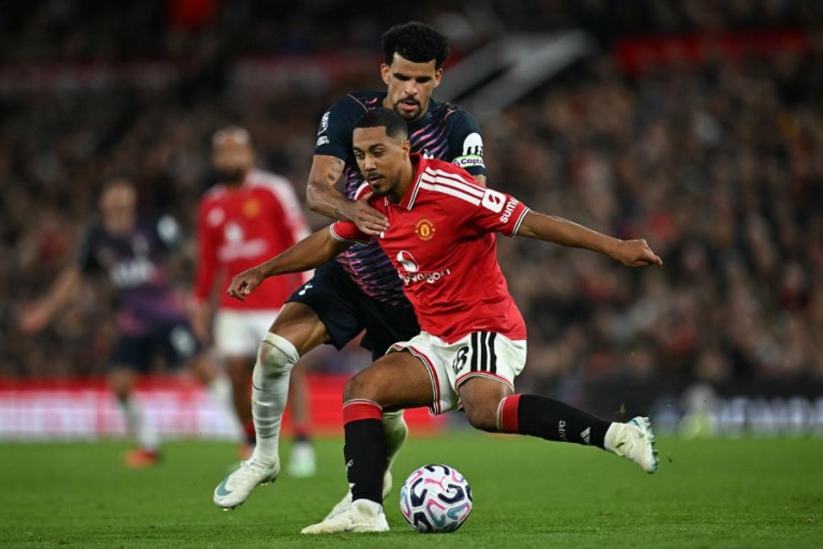 Manchester United's Belgian midfielder #18 Youri Tielemans vies with Tottenham Hotspur's English striker #19 Dominic Solanke during the English Premier League football match between Manchester United and Tottenham Hotspur at Old Trafford in Manchester, north west England, on October 10, 2026. Paul ELLIS / AFP