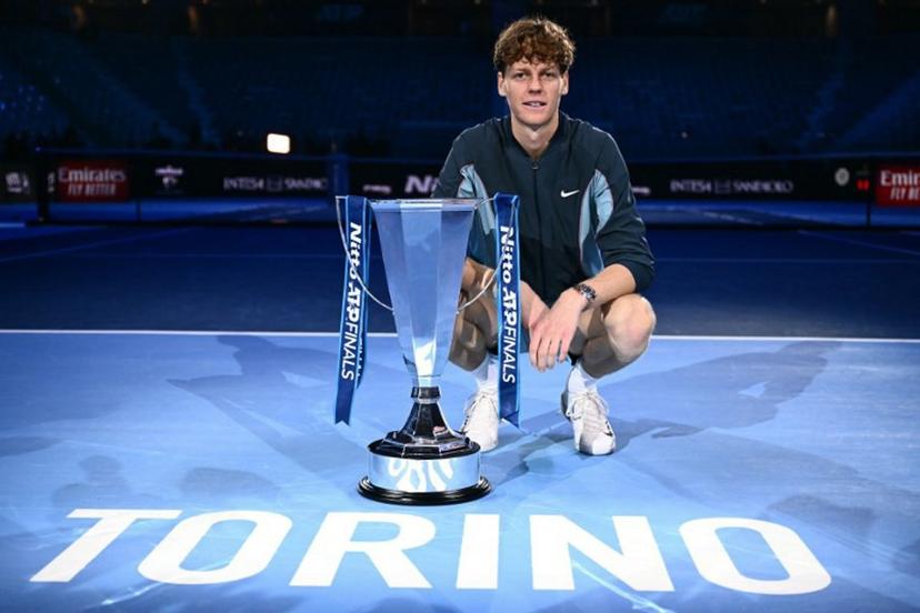 Italy's Jannik Sinner poses with the trophy after winning the final against USA's Taylor Fritz at the ATP Finals tennis tournament in Turin on November 17, 2024. Marco BERTORELLO / AFP
