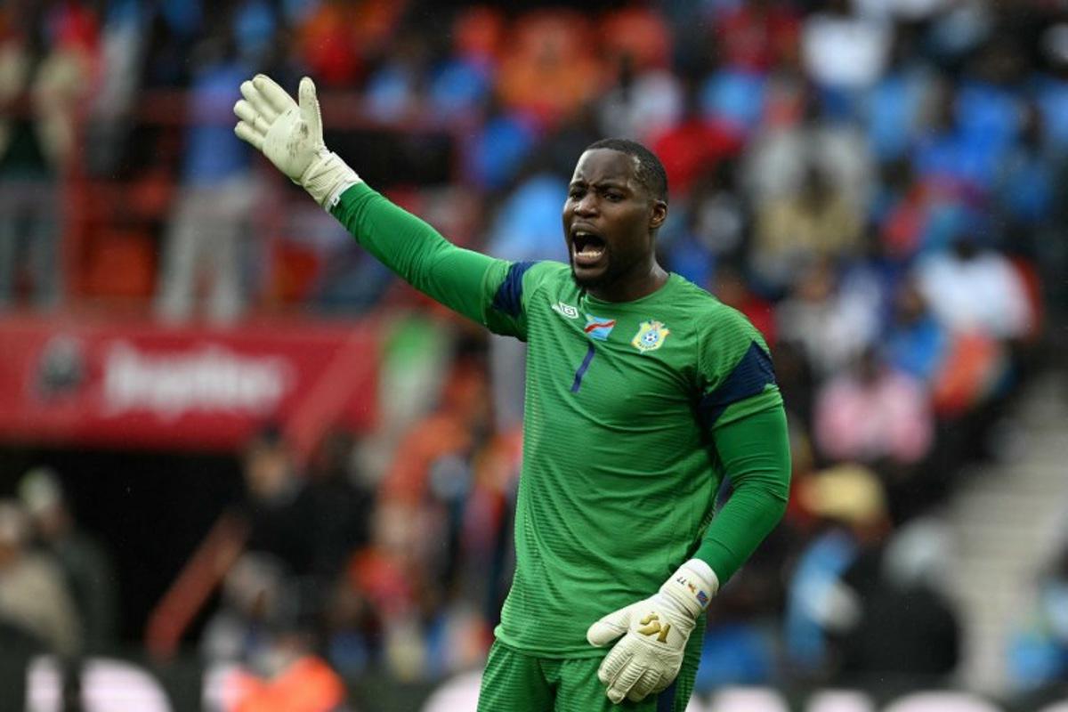 Congo's dgoalkeeper #01 Lionel Mpasi reacts during the international friendly football match between Denmark and DR Congo ahead of the 2026 FIFA World Cup football tournament at the Stade Maurice Dufrasne in Liege on June 3, 2026. NICOLAS TUCAT / AFP