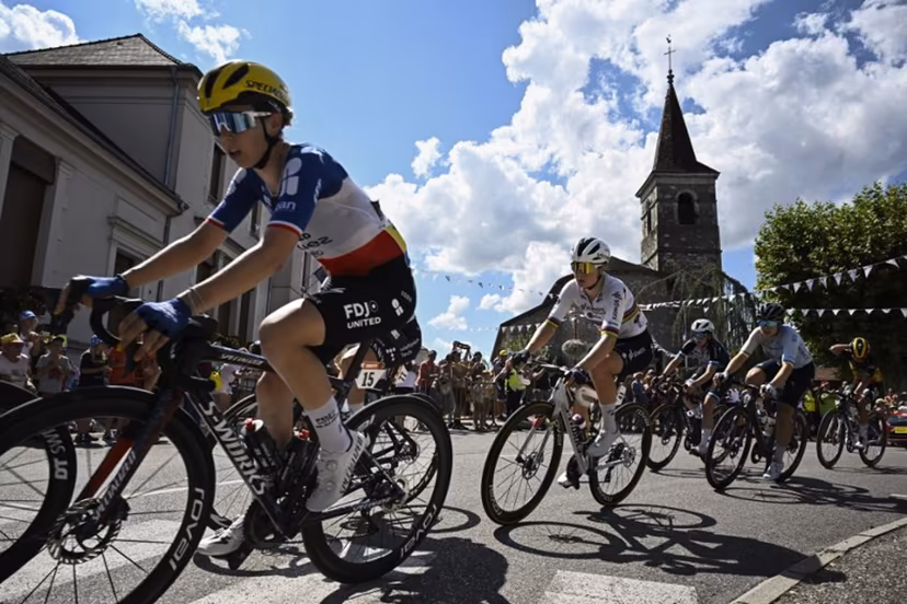 (FILES) FDJ-SUEZ team's French rider Marie Le Net (L) and Team SD Worx - Protime's Belgian rider Lotte Kopecky (C) ride in a breakaway during the 7th stage (out of 9) of the fourth edition of the Women's Tour de France - Tour de France Femmes cycling race, 159.7 km from Bourg-en-Bresse to Chambéry, in Chambéry, south-eastern France on August 1, 2025. The 5th edition of the Women's Tour de France will start in Lausanne on August 1, 2026. JULIEN DE ROSA / AFP