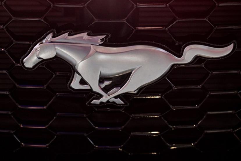 A Ford Mustang logo on is seen during the 21st Shanghai International Automobile Industry Exhibition at the National Exhibition and Convention Center in Shanghai on April 24, 2025. Hector RETAMAL / AFP