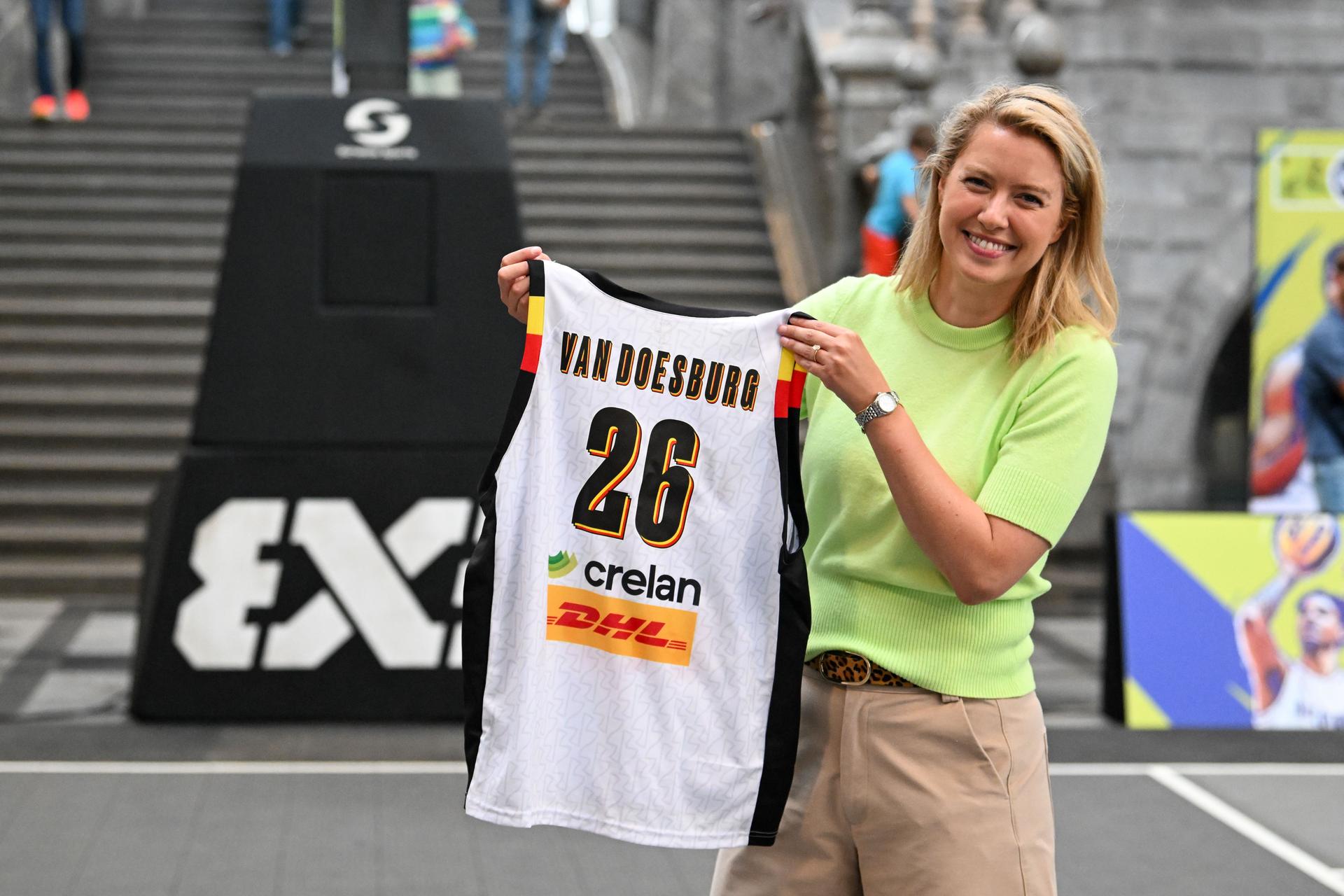 acting Antwerp mayor Els Van Doesburg poses for the photographer at poses for the photographer with a personalised shirt during the latest press conference regarding the 3x3 European Basketball Championship in Antwerp (Sept. 11-13), on Wednesday 26 August 2026 in Antwerp. BELGA PHOTO JONAS ROOSENS