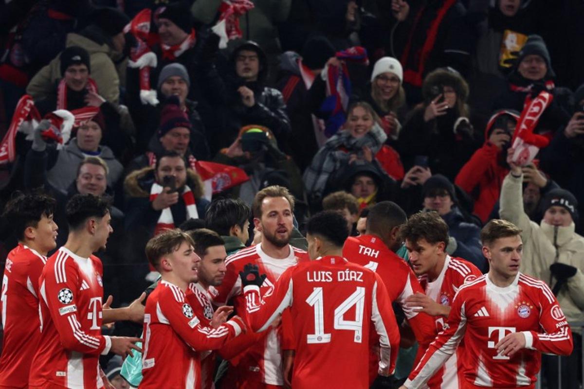 Bayern Munich's English forward #09 Harry Kane (C) is celebrated by team mates after scoring the opening goal 1-0 during the UEFA Champions League football match between FC Bayern Munich (GER) and Royale Union St-Gilloise (BEL) in Munich, southern Germany, on January 21, 2026. Karl-Josef HILDENBRAND / AFP