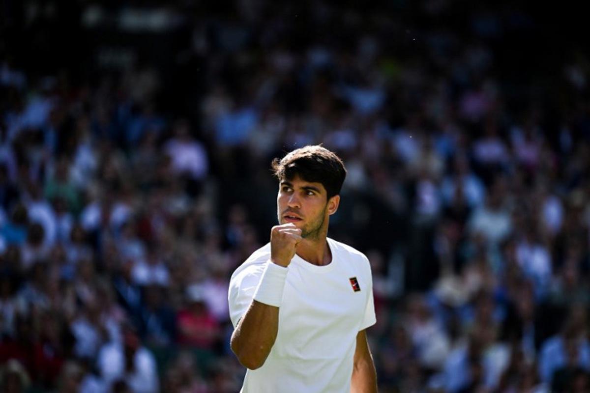Spain's Carlos Alcaraz celebrates after winning a point against Britain's Oliver Tarvet during their men's singles second round tennis match on the third day of the 2025 Wimbledon Championships at The All England Lawn Tennis and Croquet Club in Wimbledon, southwest London, on July 2, 2025. Kirill KUDRYAVTSEV / AFP