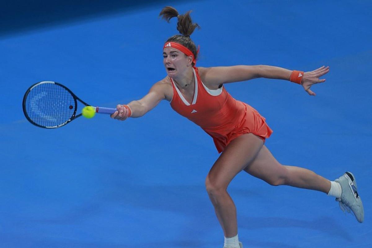 Czech Republic's Karolina Muchova hits a return against Greece's Maria Sakkari during their women's singles semi-final match at the Qatar Open tennis tournament in Doha on February 13, 2026. Karim JAAFAR / AFP