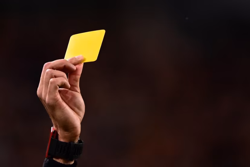 Italian referee Matteo Marchetti gives a yellow card during the Italian Serie A football match between Juventus and Hellas Verona on April 1, 2023 at the Juventus stadium in Turin. Marco BERTORELLO / AFP