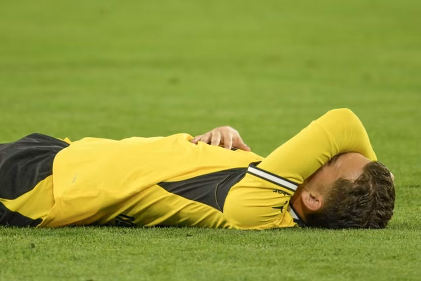 Borussia Dortmund's Greek midfielder #19 Konstantinos Karetsas lays on the pitch after injury during the UEFA Champions League - League phase, Matchday 1 - football match between BVB Borussia Dortmund and Villarreal CF in Dortmund, western Germany, on September 8, 2026. Sascha Schuermann / AFP