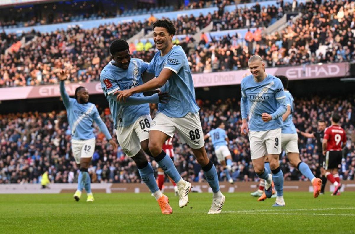 Manchester City's English defender #68 Max Alleyne (C) celebrates scoring the opening goal during the English FA Cup third round football match between Manchester City and Exeter City at the Etihad Stadium in Manchester, north west England, on January 10, 2026. Oli SCARFF / AFP