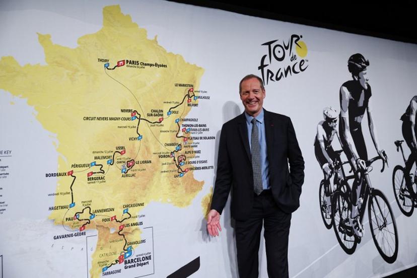 Tour de France General Director Christian Prudhomme poses for a picture in front of the map showing the women's route during the presentation of the official routes of the 2026 edition of the men's and women's Tour de France cycling race in Paris on October 23, 2025. Anne-Christine POUJOULAT / AFP