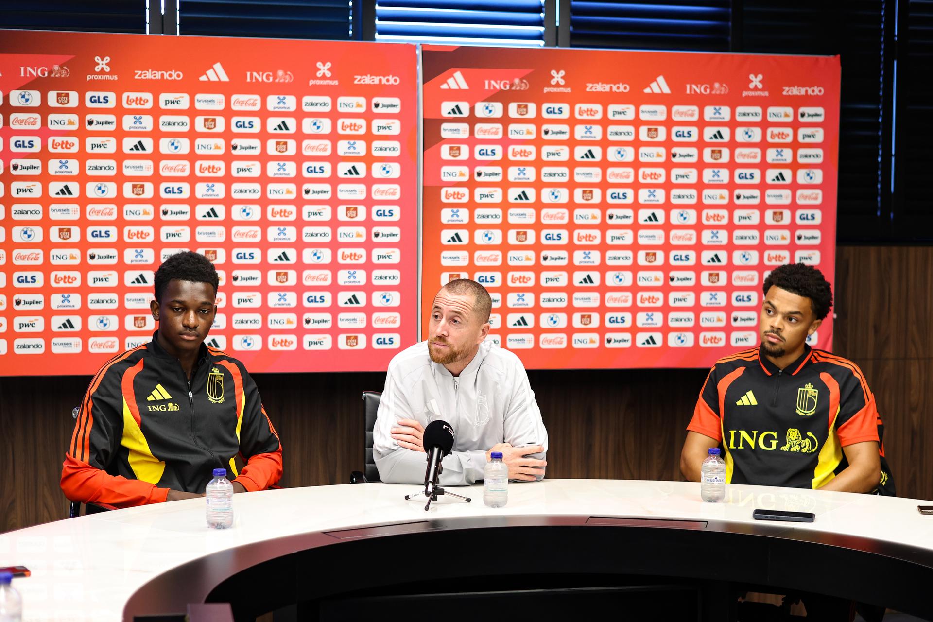 Belgium's Jesse Bisiwu; Belgium's U21 head coach Gil Swerts and Belgian Lucas Noubi pictured during a press conference of the Red Devils U21 youth team, the Belgian youth national soccer team, at the national training center in Tubize, Wednesday 23 September 2026. The team is preparing for fixtures in the Euro 2027 qualifiers games. BELGA PHOTO BRUNO FAHY
