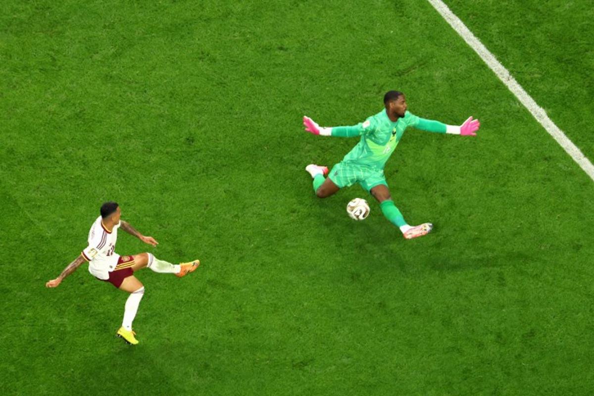 Spain's defender #12 Pedro Porro scores his team's second goal past France's goalkeeper #16 Mike Maignan during the 2026 World Cup football tournament semi-final match between France and Spain at the Dallas Stadium in Arlington on July 14, 2026. Odd ANDERSEN / AFP