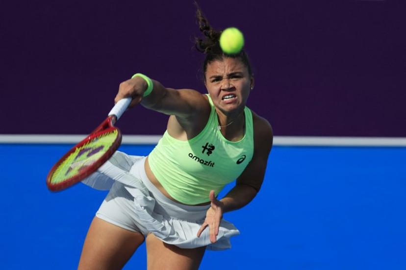 Italy's Jasmine Paolini serves against Greece's Maria Sakkari during their women's singles match at the Qatar Open tennis tournament in Doha on February 10, 2026. Karim JAAFAR / AFP