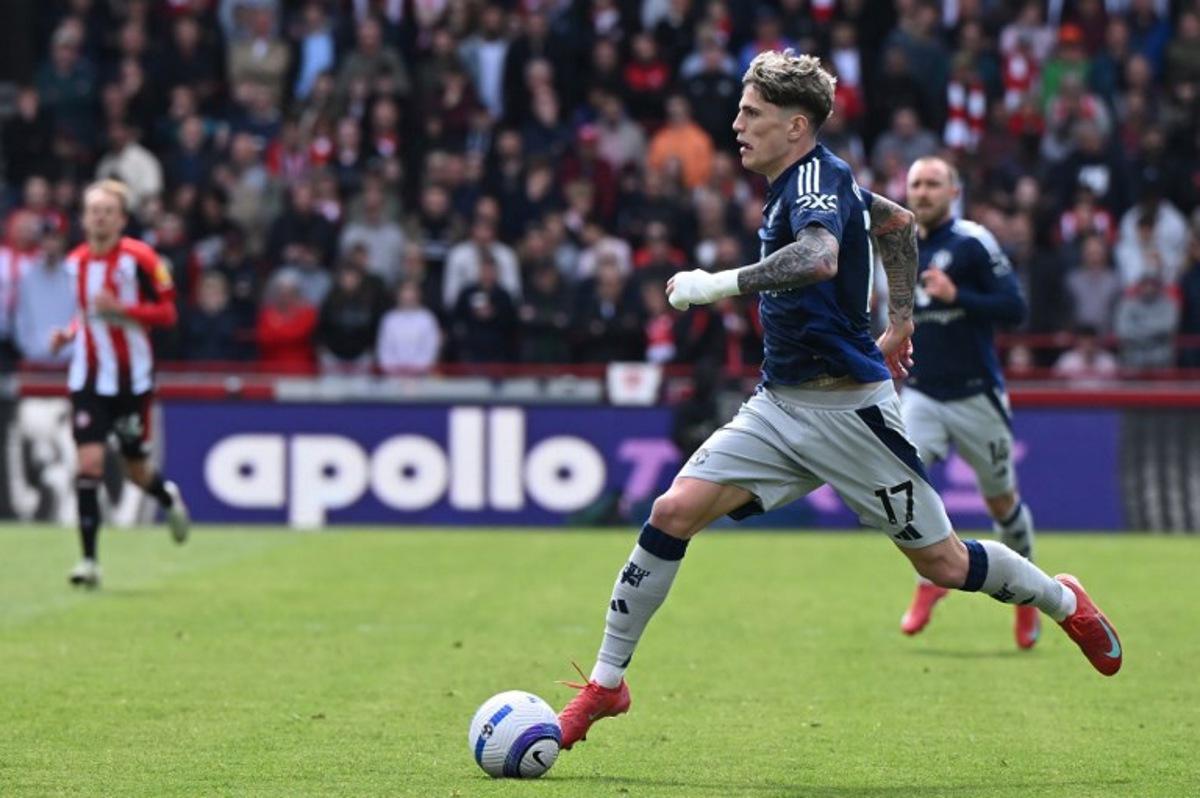 Manchester United's Argentinian midfielder #17 Alejandro Garnacho runs with the ball during the English Premier League football match between Brentford and Manchester United at the Gtech Community Stadium in London on May 4, 2025. JUSTIN TALLIS / AFP