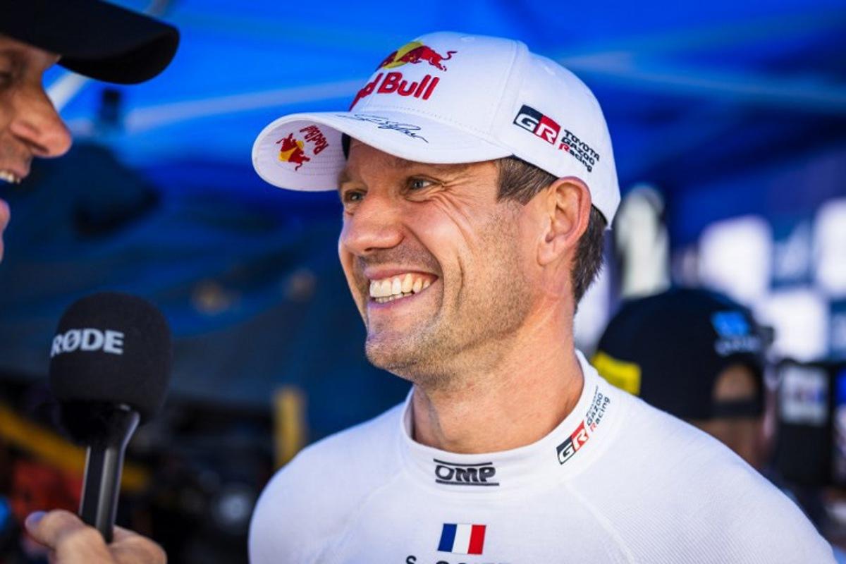 French driver Sebastien Ogier (R) gives an interview during the regroup section at the WRC Rally Finland in Jyvaskyla, Finland on August 2, 2025. Valtteri Vainio / Lehtikuva / AFP