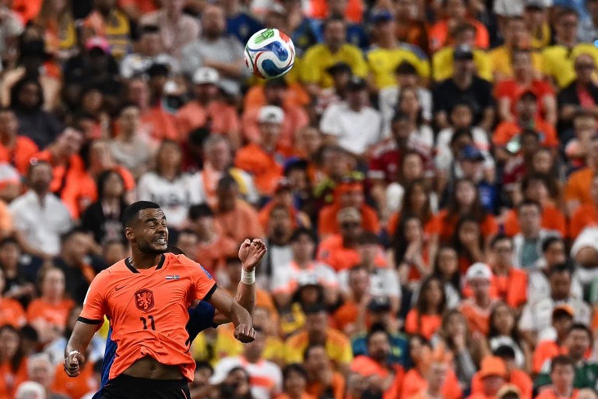 Netherlands' forward #11 Cody Gakpo jumps for the ball during the 2026 World Cup Group F football match between the Netherlands and Sweden at the Houston Stadium in Houston on June 20, 2026. Paul ELLIS / AFP