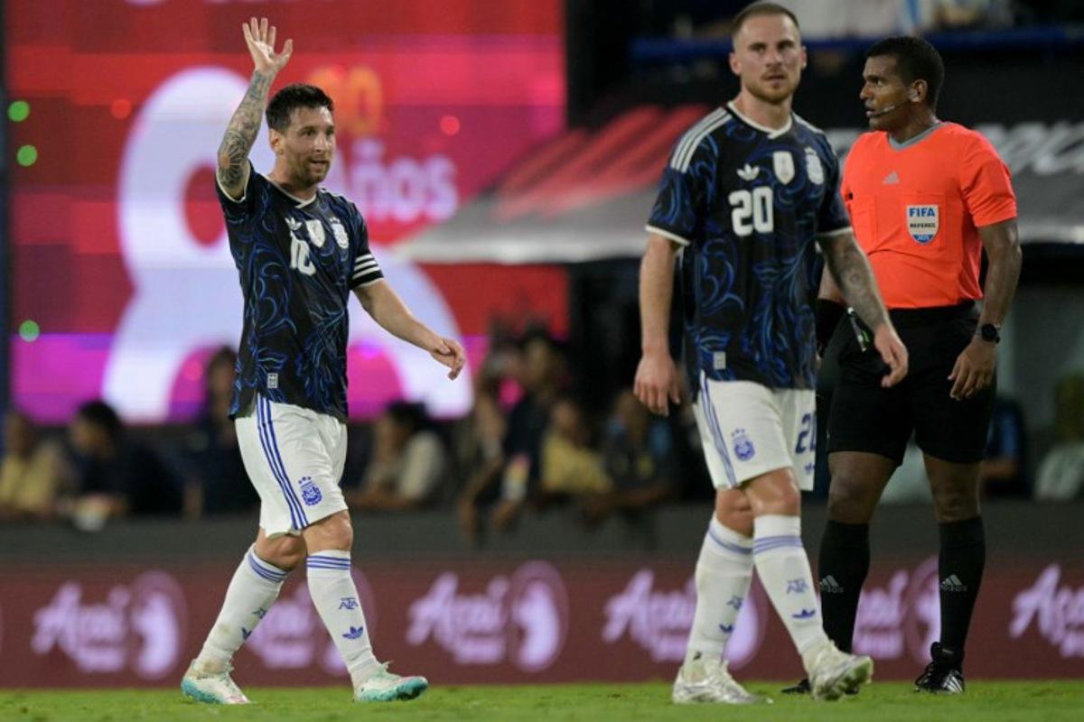 Argentina's forward #10 Lionel Messi gestures next to teammate midfielder #20 Alexis Mac Allister during a friendly football match between Argentina and Zambia at La Bombonera stadium in Buenos Aires on March 31, 2026. JUAN MABROMATA / AFP