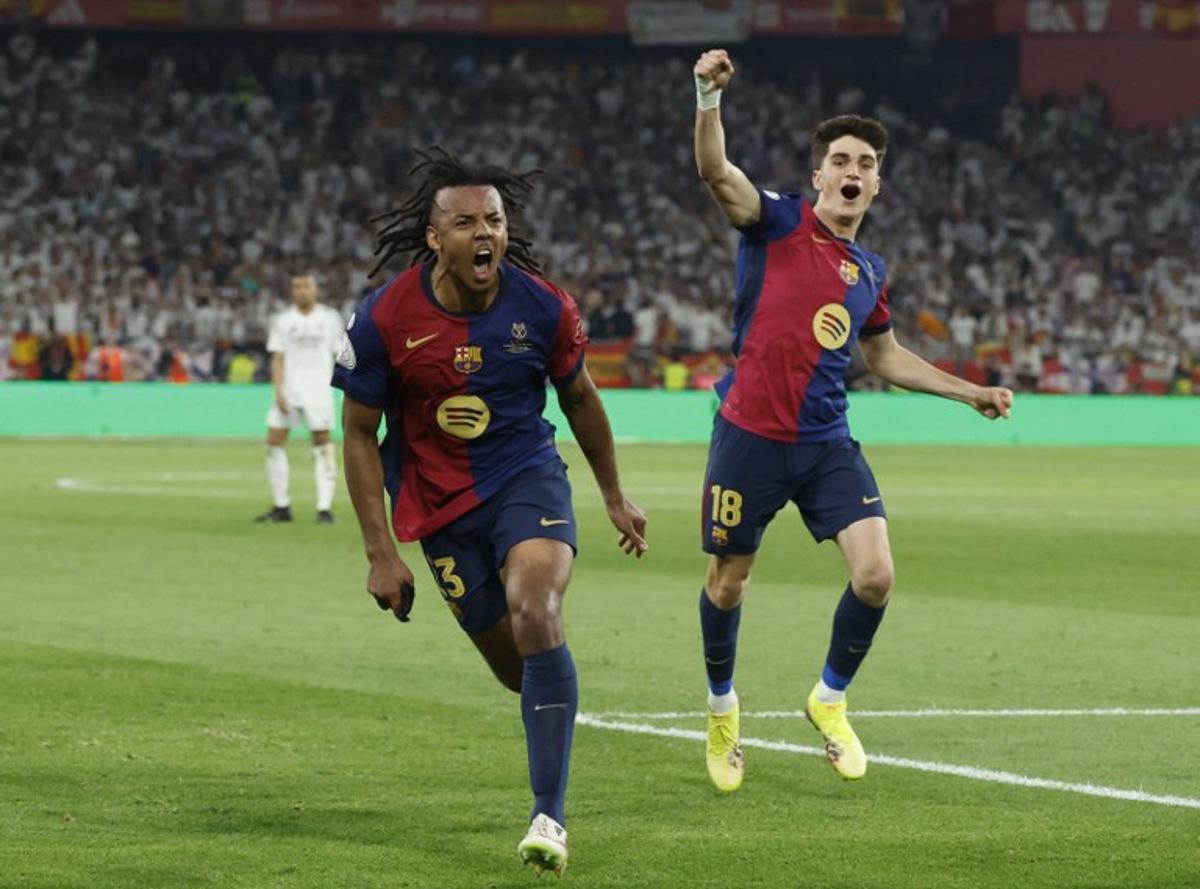 Barcelona's French defender #23 Jules Kounde (L) celebrates scoring his team's third goal during their Spanish Cup, Copa del Rey (King's Cup) final football match between FC Barcelona and Real Madrid CF at La Cartuja stadium in Seville on April 26, 2025. Pierre-Philippe MARCOU / AFP