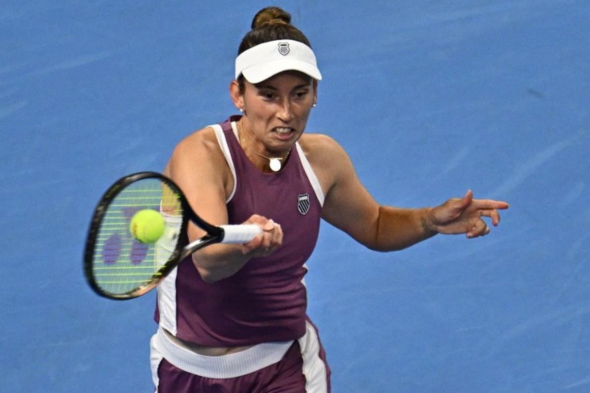 Belgium's Elise Mertens hits a return to Poland's Iga Swiatek during their women's singles quarter-final at the China Open tennis tournament in Beijing on October 9, 2026. Pedro Pardo / AFP