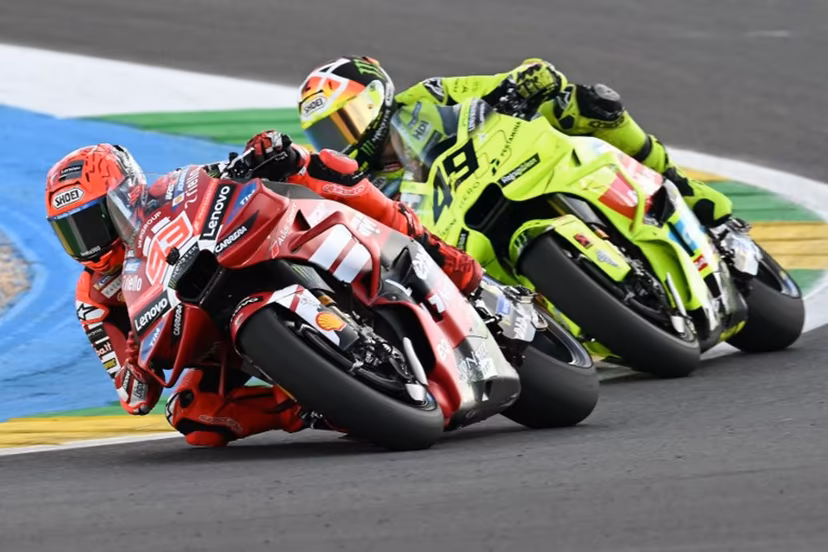 Ducati Lenovo's Spanish rider Marc Marquez (L) and Pertamina Enduro VR46 Racing Team's Italian rider Fabio Di Giannantonio compete during the MotoGP sprint of the Grand Prix of Brazil at the Ayrton Senna International racetrack in Goiania, state of Goias, Brazil, on March 21, 2026. EVARISTO SA / AFP