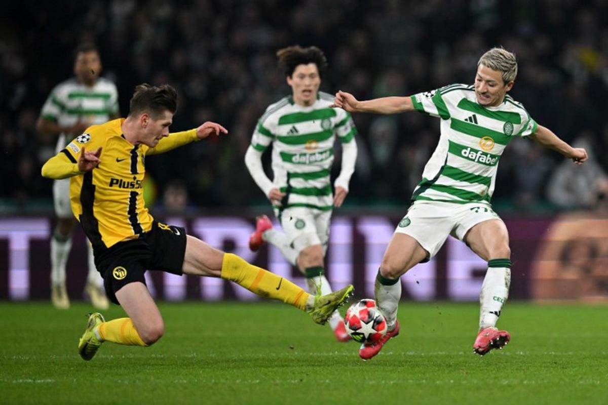 Young Boys' Polish midfielder #08 Lukasz Lakomy battles for the ball with Celtic's Japanese striker #38 Daizen Maeda during the UEFA Champions League football match between Celtic and Young Boys at Celtic Park stadium in Glasgow, Scotland on January 22, 2025. ANDY BUCHANAN / AFP