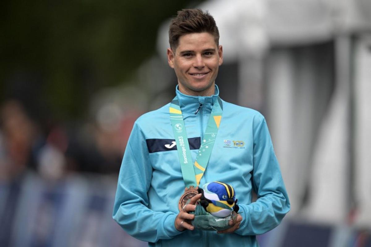 Uruguay's Antonio Eric Fagundez stands on the podium with his bronze medal in the cycling men's road race final during the Pan American Games Santiago 2023 in Santiago on October 29, 2023. ERNESTO BENAVIDES / AFP