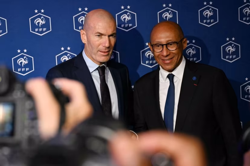 Former French international football player Zinedine Zidane (L) and President of the French Football Federation (FFF) Philippe Diallo (R) pose after a press conference to present him as the new head coach of France national football team at the French Football Federation headquarters (FFF) in Paris on July 28, 2026. The former France playmaker, who won the 1998 World Cup and the 2000 European Championship as a player, has been appointed head coach of the French national team, succeeding Didier Deschamps, the French Football Federation (FFF) announced. Zidane takes over from his former teammate Deschamps, who had been in charge since 2012; Deschamps' tenure ended with a fourth-place finish at the 2026 World Cup, following a title win in 2018 and a final appearance in 2022. LOU BENOIST / AFP