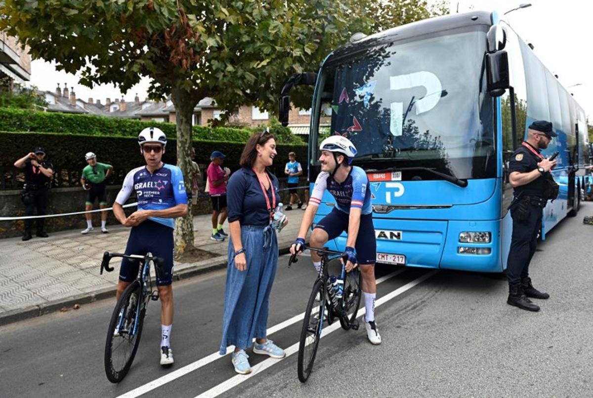 Team Israel Premier-Tech's Canadian rider Pier-Andre Cote (L) and Team Israel Premier-Tech Czech rider Jan Hirt prepare before the 12th stage of the Vuelta a Espana, a 144,9 km race between Laredo and Corrales de Buelna, on September 4, 2025. ANDER GILLENEA / AFP