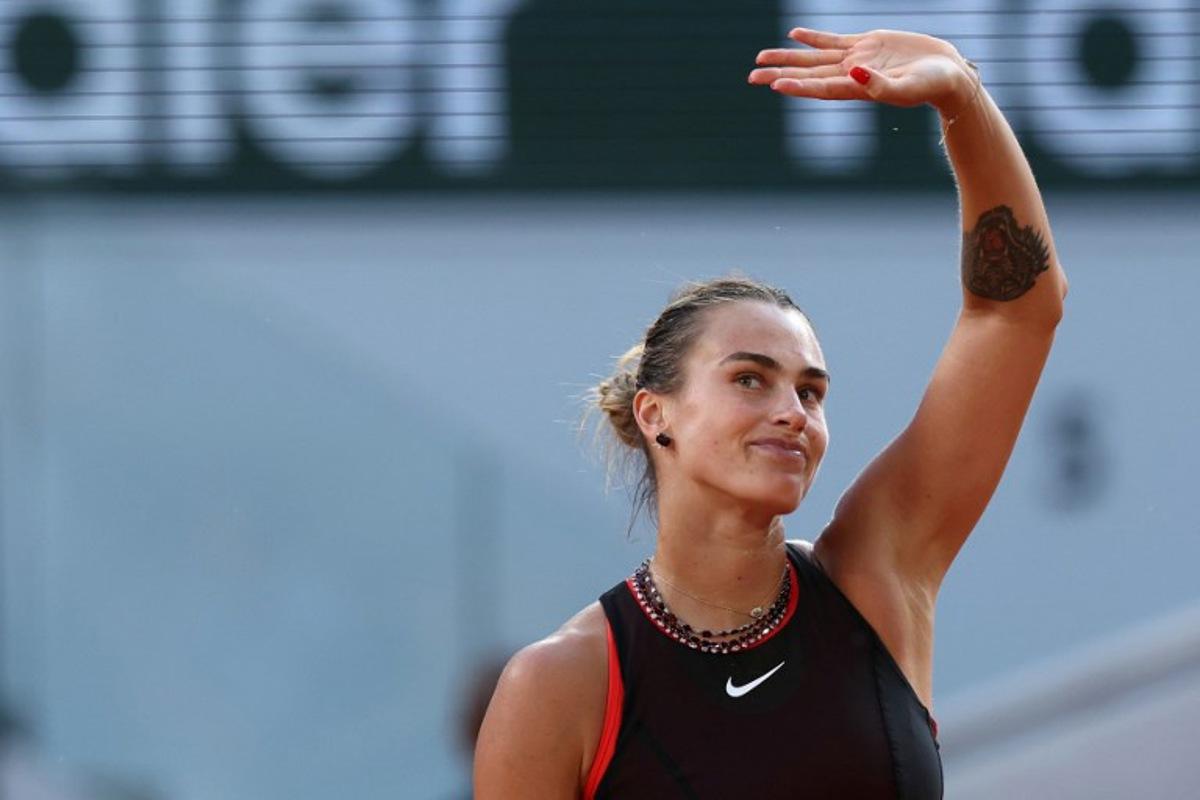 Aryna Sabalenka acknowledges the crowd as she celebrates her victory at the end of her women's singles match against France's Elsa Jacquemot on Court Philippe-Chatrier on day 5 of the French Open tennis tournament at the Roland-Garros Complex in Paris on May 28, 2026. ALAIN JOCARD / AFP