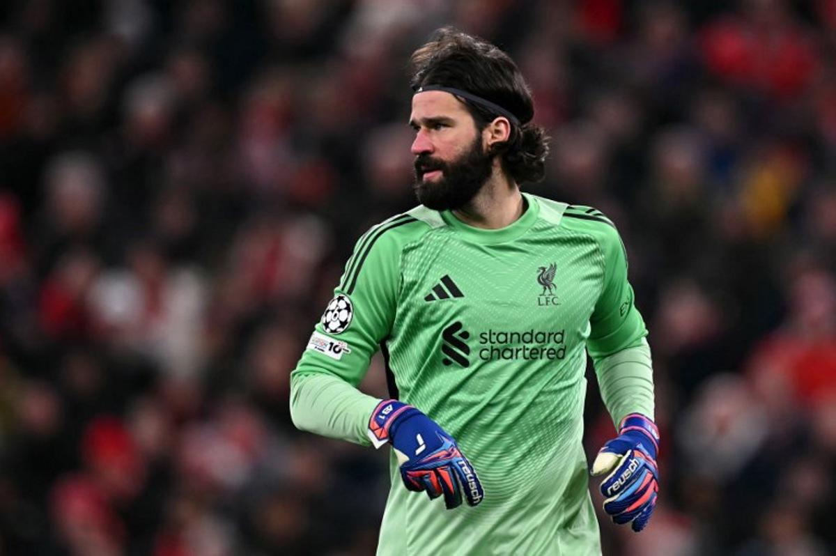 Liverpool's Brazilian goalkeeper #01 Alisson Becker looks on during the UEFA Champions League football match between Liverpool and Qarabag at Anfield in Liverpool, north west England on January 28, 2026. Paul ELLIS / AFP