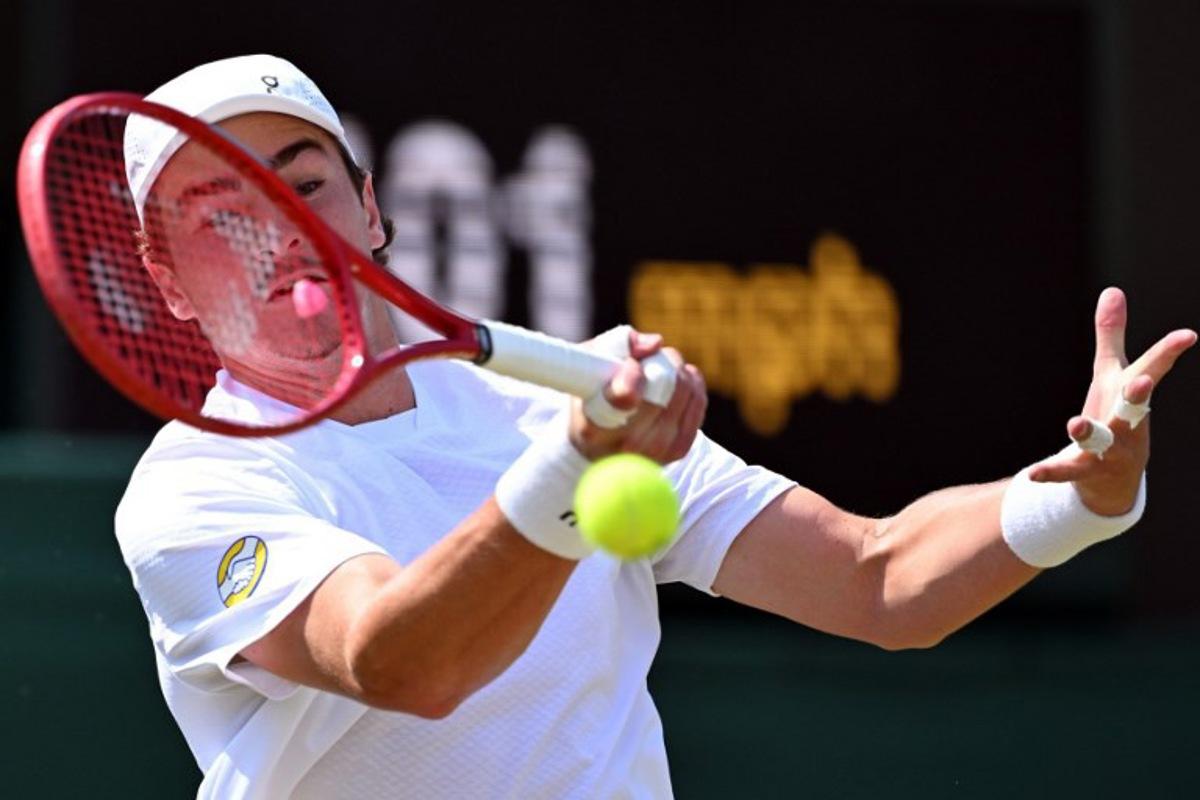 Brazil's Joao Fonseca returns to Russia's Roman Safiullin during their men's singles third round tennis match on the fifth day of the 2026 Wimbledon Championships at The All England Lawn Tennis and Croquet Club in Wimbledon, southwest London, on July 3, 2026. Kirill KUDRYAVTSEV / AFP
