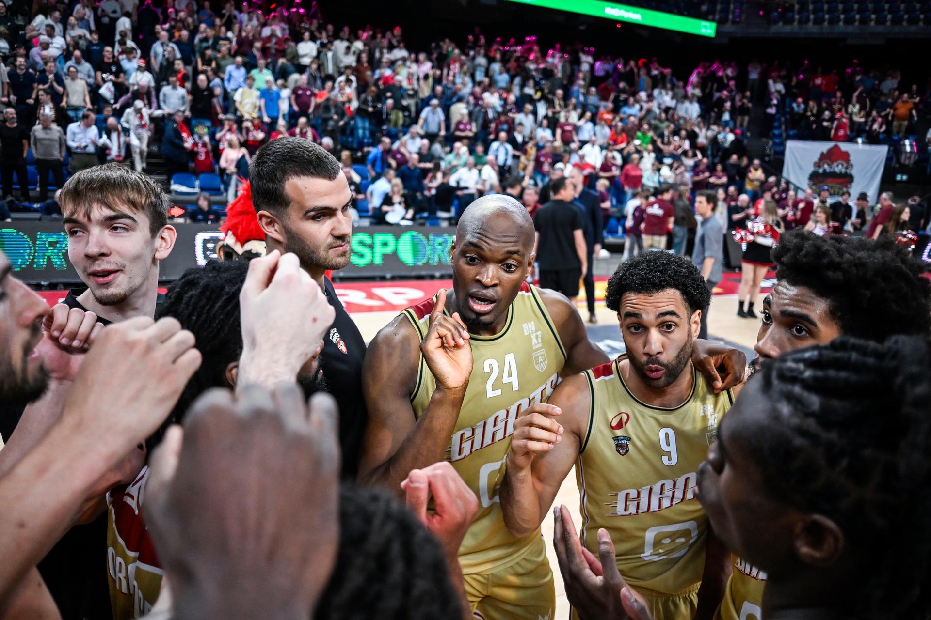 Antwerp's Kevin Tumba and Antwerp's Elias Lasisi celebrate after winning a basketball match between Antwerp Giants and BC Oostende, Thursday 15 May 2025 in Antwerp, a quarter final game (2nd leg, best-of-3) in the playoffs of the 'BNXT League' Belgian/ Dutch first division basket championship. BELGA PHOTO TOM GOYVAERTS