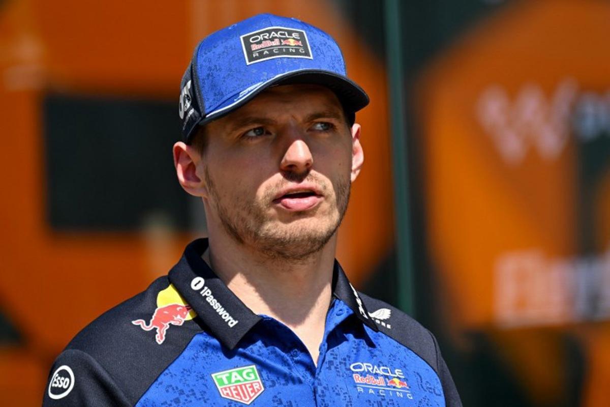 Red Bull Racing's Dutch driver Max Verstappen walks down the paddock ahead of the Formula One British Grand Prix at the Silverstone motor racing circuit in Silverstone, central England, on July 2, 2026. Andrej ISAKOVIC / AFP
