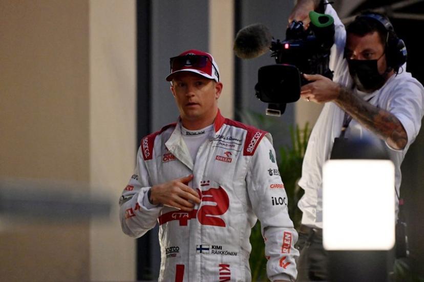 Alfa Romeo's Finnish driver Kimi Raikkonen walks back in his team's hospitality after he retired from the race at the Yas Marina Circuit during the Abu Dhabi Formula One Grand Prix on December 12, 2021. ANDREJ ISAKOVIC / AFP