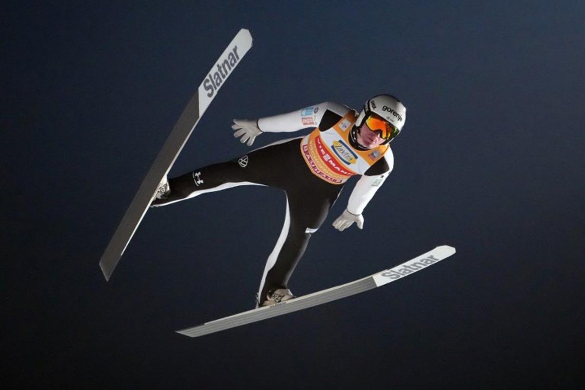 Slovenia's Domen Prevc soars through the air during the Men's Individual Large Hill HS142 event of the FIS Ski Jumping World Cup, the fourth and last leg of the Four Hills Tournament, in Bischofshofen, Austria on January 6, 2026. GEORG HOCHMUTH / APA / AFP