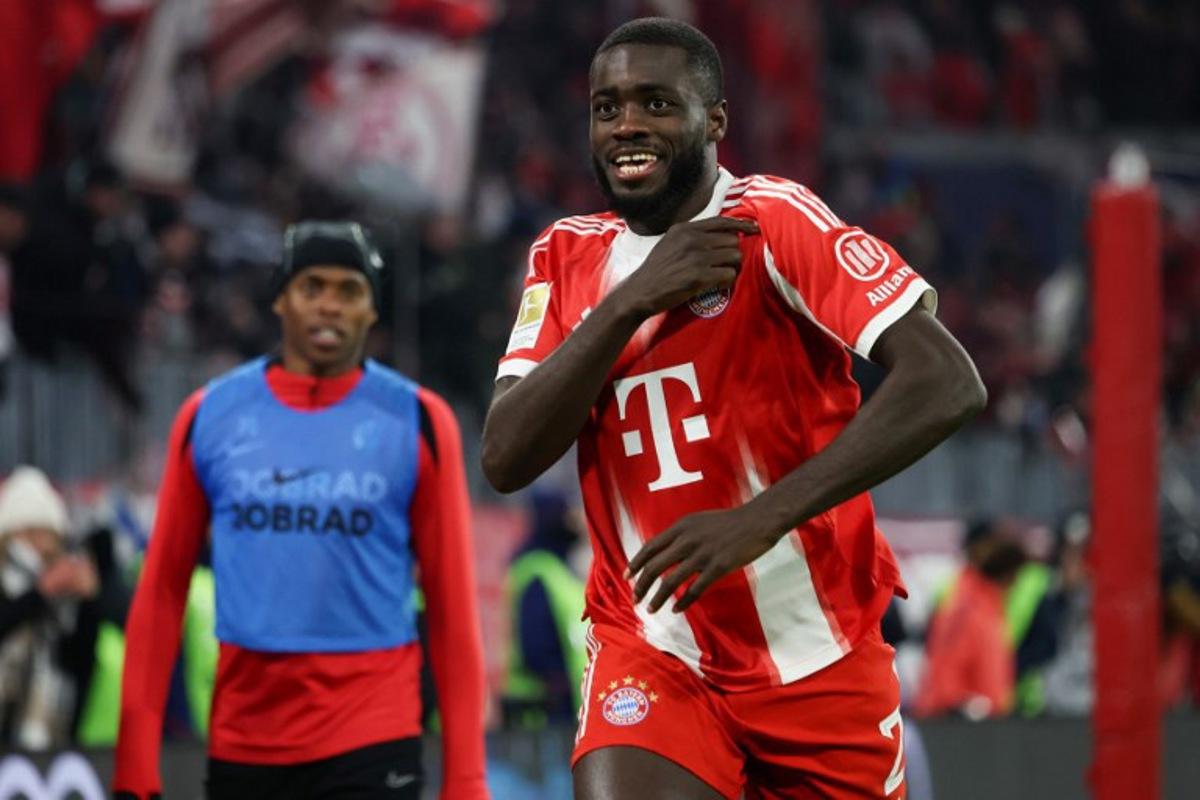 Bayern Munich's French defender #02 Dayot Upamecano celebrates scoring his team's third goal during the German first division Bundesliga football match between FC Bayern Munich and SC Freiburg in Munich, southern Germany on November 22, 2025. Karl-Josef HILDENBRAND / AFP