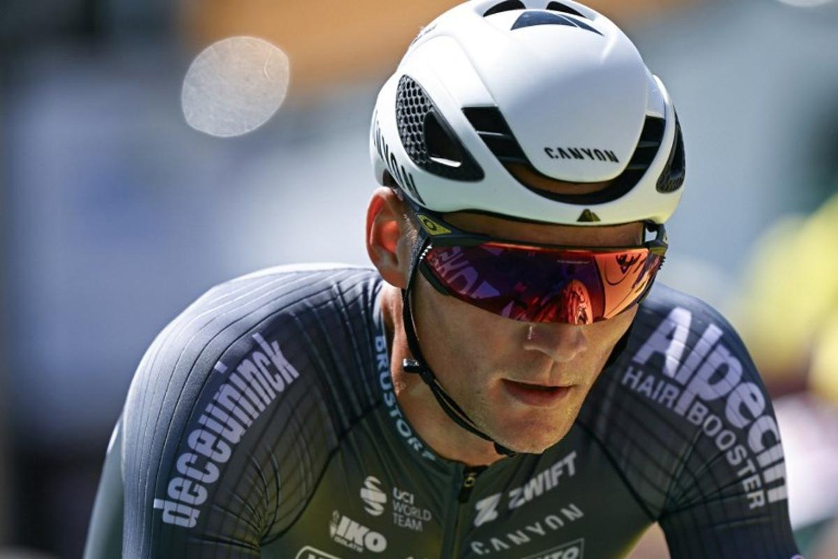 Alpecin - Deceuninck team's Dutch rider Mathieu van der Poel cycles to the finish line of the 13th stage of the 112th edition of the Tour de France cycling race, 10.9 km individual time trial between Loudenvielle and Peyragudes, in the Pyrenees mountains of southwestern France, on July 18, 2025. Loic VENANCE / AFP