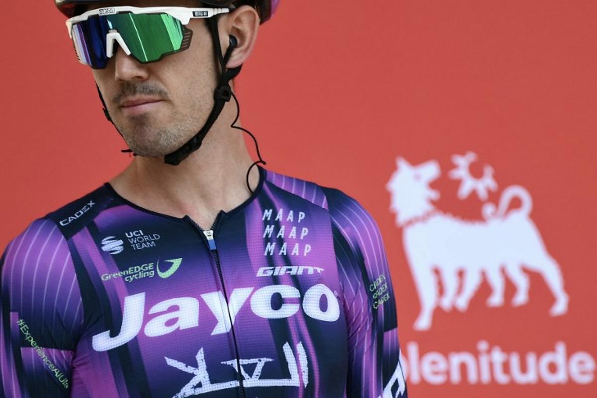 Team Jayco-AlUla's Australian rider Ben O'Connor is presented on stage before the start of the Vuelta a Espana, a 183 km race between Torino - Reggia di Venaria and Novara, in Italy's Piemonte region, on August 23, 2025. Marco BERTORELLO / AFP