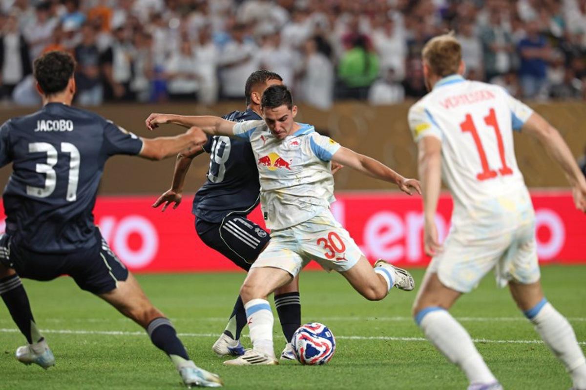 Real Madrid's Spanish defender #31 Jacobo Ramon and Real Madrid's Spanish midfielder #19 Dani Ceballos (2nd L) fights for the ball with Salzburg's Israeli midfielder #30 Oscar Gloukh during the FIFA Club World Cup 2025 Group H football match between Austria's FC Salzburg and Spain's Real Madrid at Lincoln Financial Field Stadium in Philadelphia on June 26, 2025. FRANCK FIFE / AFP