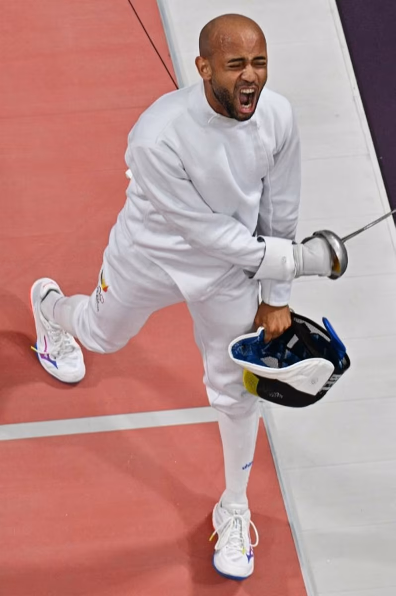 An overview shows Belgium's Neisser Loyola (L) reacting as he competes against Hungary's Gergely Siklosi in the men's epee individual round of 16 bout during the Paris 2024 Olympic Games at the Grand Palais in Paris, on July 28, 2024. Jewel SAMAD / AFP