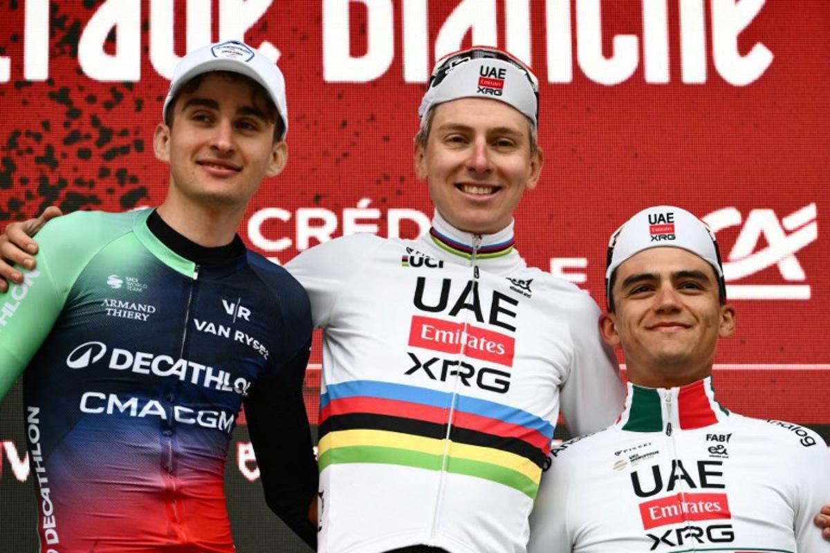 (From L) Second placed UCI WorldTeam Decathlon CMA CGM's French Paul Seixas, first placed UAE Team Emirates's Slovenian Tadej Pogacar and third placed Del UAE Team Emirates XRG's MexicanIsaac Del Toro Romero celebrate on the podium after competing in the 20th one-day classic 'Strade Bianche' (White Roads) men's cycling race between Siena and Siena in Tuscany on March 7, 2026. Marco BERTORELLO / AFP