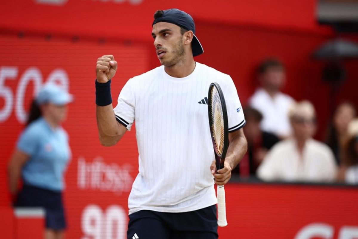 Argentina's Francisco Cerundolo reacts after winning the second set against US player Tommy Paul during the men's singles final tennis match on day six of the ATP HSBC Championships at Queen's Club in west London on June 21, 2026. Henry Nicholls / AFP