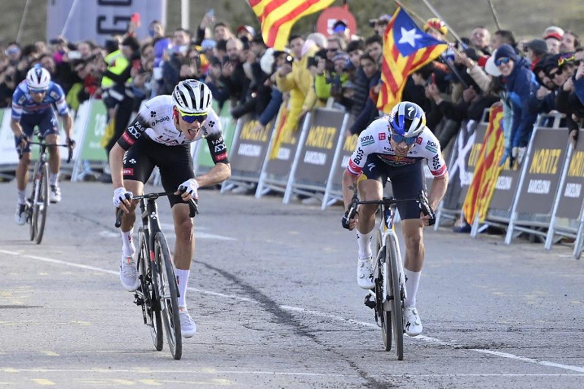 Team UAE's Juan Ayuso (C) and Team Bora's Primoz Roglic (R) sprint to cross the finish line in first and second place respectively followed by Team Soudal-Quick Step's Mikel Landa (L) during the 3rd stage of the 2025 Volta a Catalunya cycling tour of Catalonia, a 178,3 km race between Viladecans and La Molina, on March 26, 2025. Josep LAGO / AFP