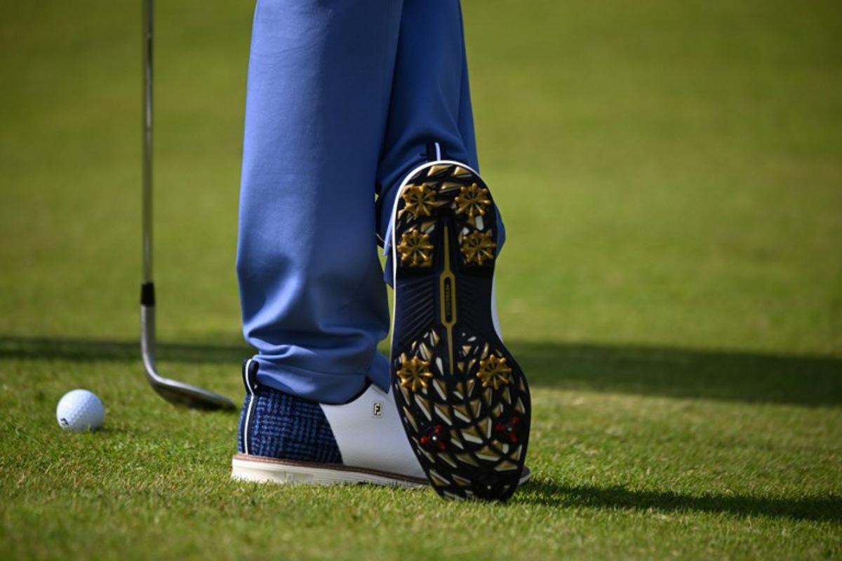 A detailed view of the shoes of US golfer Justin Thomas, seen during practice ahead of the 152nd British Open Golf Championship at Royal Troon on the south west coast of Scotland on July 15, 2024. ANDY BUCHANAN / AFP