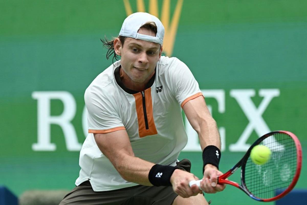 Belgium's Zizou Bergs hits a return to Canada's Gabriel Diallo during their men's singles match at the Shanghai Masters tennis tournament in Shanghai on October 7, 2025. Jade Gao / AFP