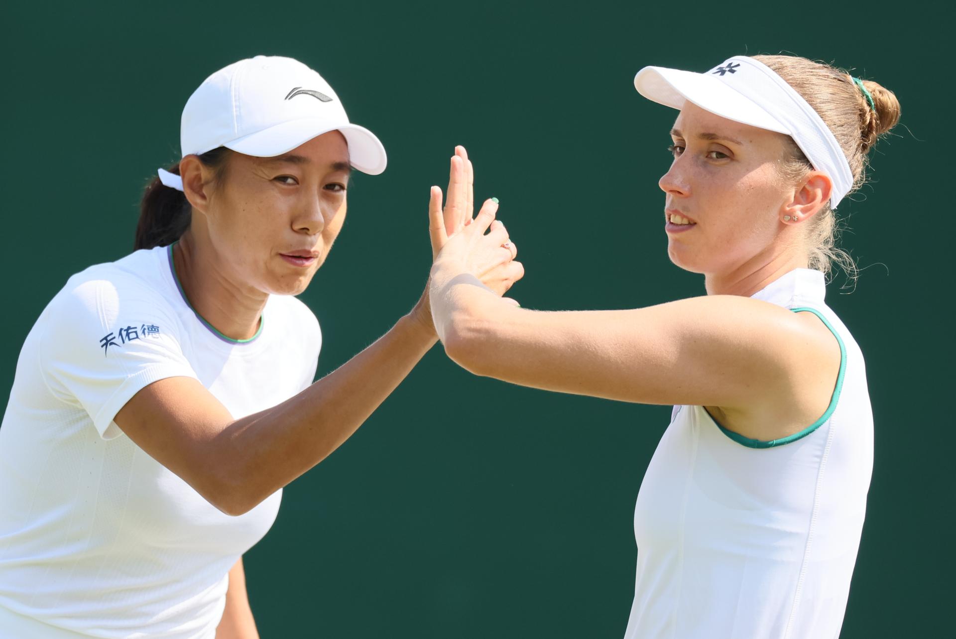Chinese Tianhui Zhang and Belgian Elise Mertens pictured during a doubles tennis match between Romanian pair Cristian-Begu and Belgian-Chinese pair Mertens-Zhang, in the first round of the Women's doubles at the Wimbledon grand slam tennis tournament in London, Britain, Friday 03 July 2026. BELGA PHOTO BENOIT DOPPAGNE