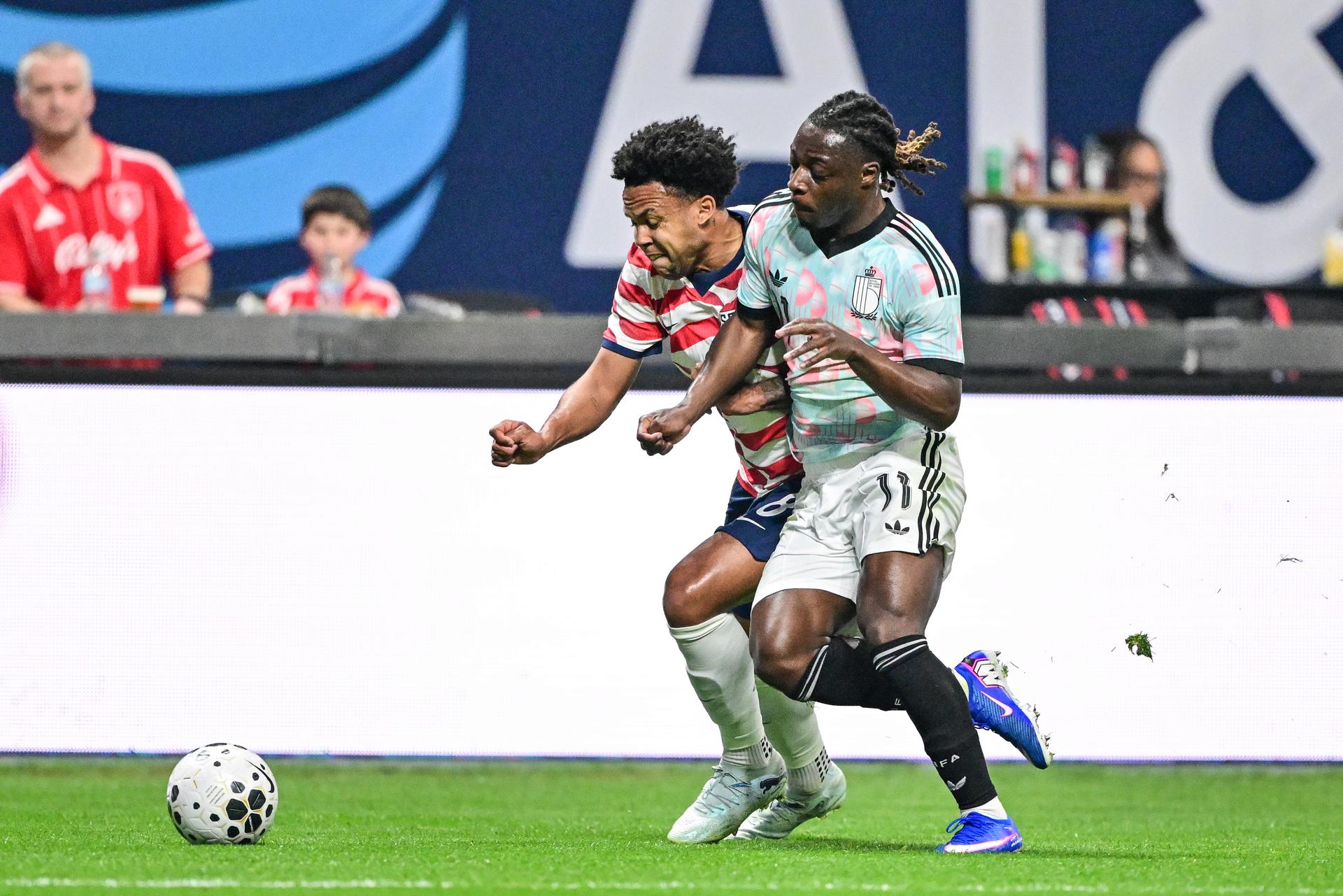 US's Weston McKennie and Belgium's Jeremy Doku fight for the ball during a friendly soccer game between the United States national team and Belgian national soccer team Red Devils in Atlanta, on Saturday 28 March 2026, in preparation for the 2026 World Cup. BELGA PHOTO DIRK WAEM